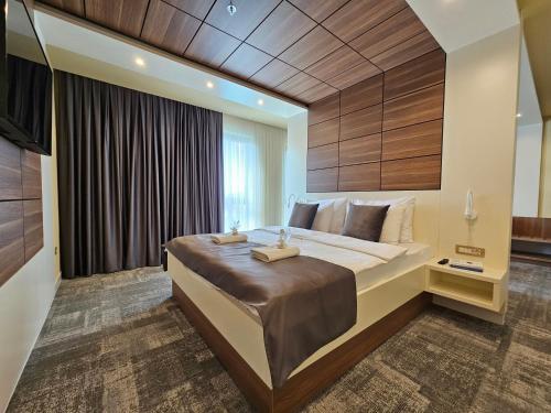 Postel nebo postele na pokoji v ubytování Hotel ETNA