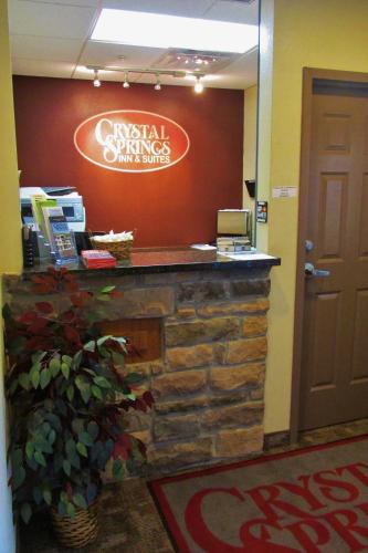 a sign for a dental clinic in a lobby at Crystal Springs Inn and Suites in Towanda