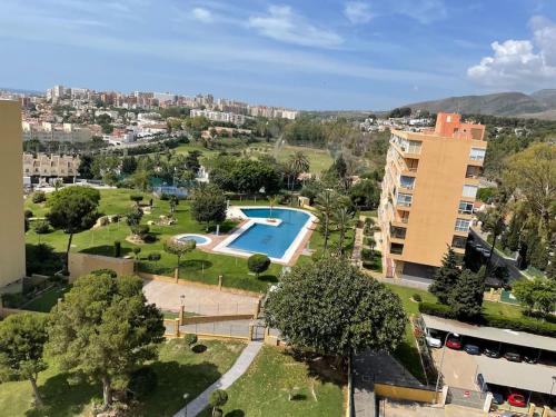 an aerial view of a park with a swimming pool at Appartement Vue mer PLAYA MAR in Torremolinos