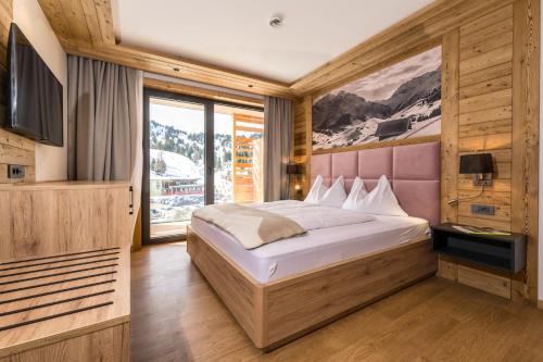 Postel nebo postele na pokoji v ubytování Alpin Peaks