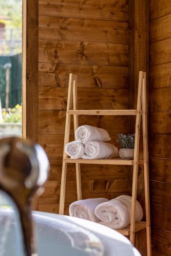 a towel rack in a bathroom with towels at Luxury Summer House in La Spezia