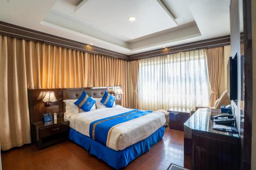 Cama o camas de una habitación en Shangrila Blu Hotel