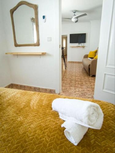 a hotel room with a white towel on the floor at La Tienda de Miguel in El Chorro