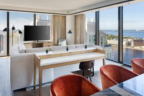 a living room with a couch and a television at JW Marriott Tampa Water Street in Tampa