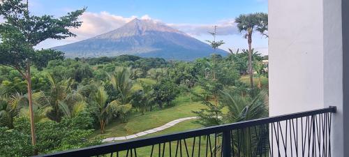 a view of a mountain from a balcony at Palm Springs Bali Dive Resort in Tulamben