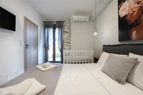 Ένα ή περισσότερα κρεβάτια σε δωμάτιο στο Stone Project Villa
