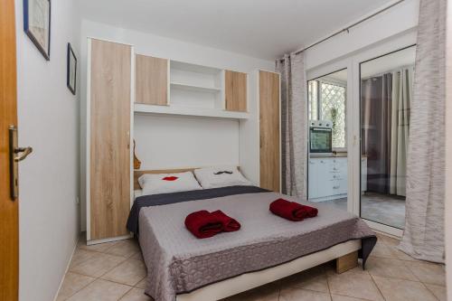 Posteľ alebo postele v izbe v ubytovaní Apartments Jagunic