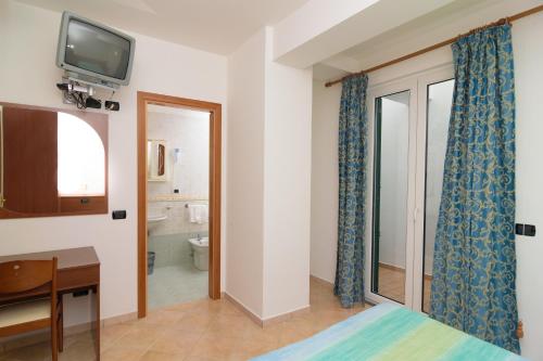 Un ou plusieurs lits dans un hébergement de l'établissement Hotel Villa Fumerie