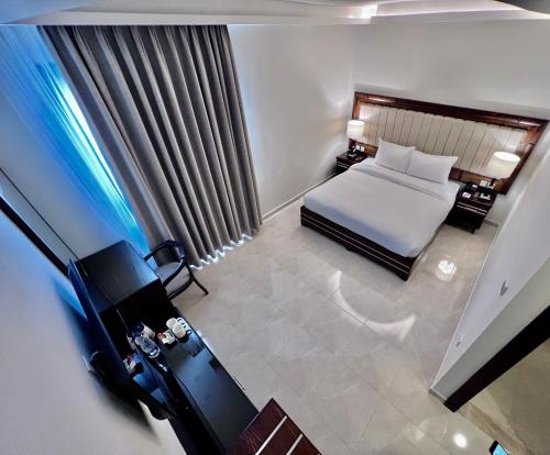 Cama o camas de una habitación en Petra Icon Hotel
