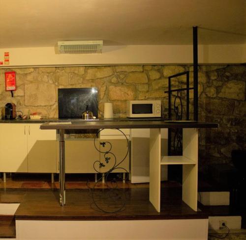 TV a/nebo společenská místnost v ubytování One bedroom apartement with wifi at Porto