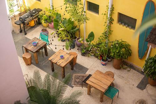 an overhead view of a patio with tables and potted plants at Tarawanda House by Stawi in Stone Town