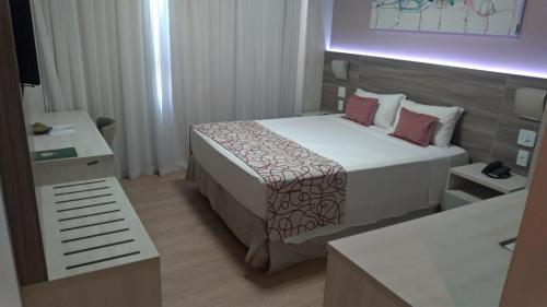 Krevet ili kreveti u jedinici u objektu IT Itabira Hotel