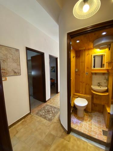 a bathroom with a toilet and a sink at Casa Scala Dei Turchi in Realmonte