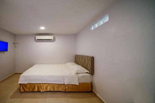 Postel nebo postele na pokoji v ubytování Hotel Uptown Semenyih