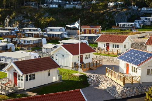 a group of houses with solar panels on them at Lagunen Cottages and Hostel in Strömstad