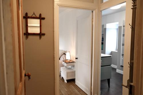 a bathroom with a toilet and a sink in a room at Contes à Rebours - Chambres d'hôtes in Morlaix
