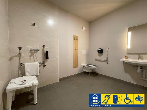 a bathroom with a toilet and a sink at B&B HOTEL Bordeaux Langon in Langon