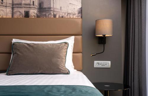 Postel nebo postele na pokoji v ubytování Leonardo Hotel Bucharest City Center