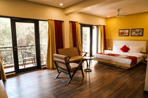 Tempat tidur dalam kamar di Rosetum Anjuna Goa