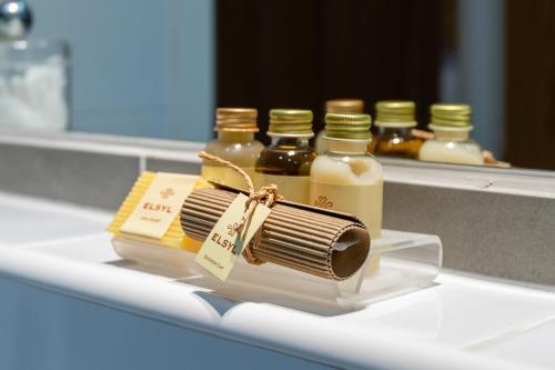 a comb and a bottle of honey on a shelf at 138 North Street - luxury 2 bed 2 bath with secret garden, summerhouse, putting green in St. Andrews
