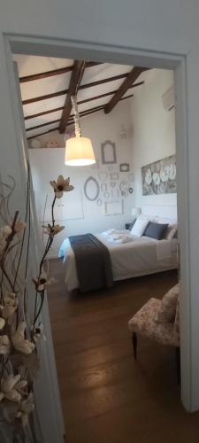 a bedroom with a large bed and a room with at White House in Orvieto