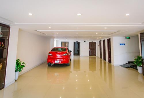 a red car parked in the middle of a hallway at Cao Minh Hotel in Lao Cai