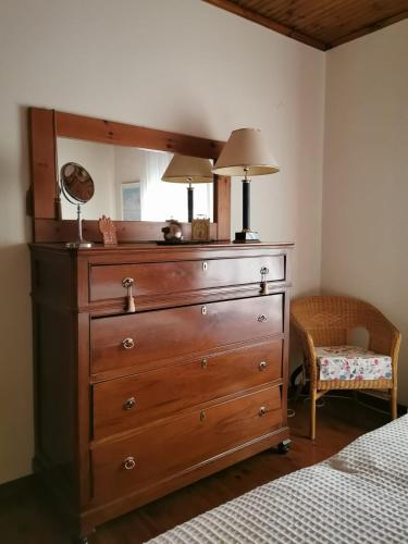 a dresser with a lamp on top of it in a bedroom at Villa Christina in Karfas