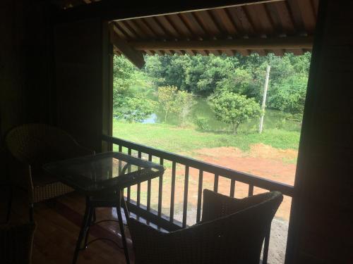 a view of a balcony with a table and chairs at Ha Giang Lake View House in Ha Giang