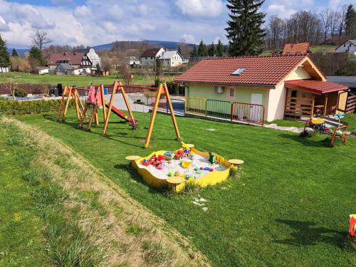 a group of playground equipment in a yard at Górska Chatka in Bukowiec
