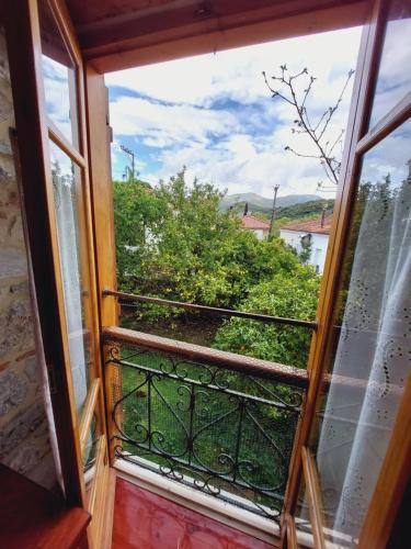 a view from the window of a balcony at Large Stone Villa with garden. in Khánia