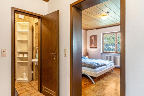 a door leading to a bedroom with a bed at Hirschturmblick in Zell am Harmersbach