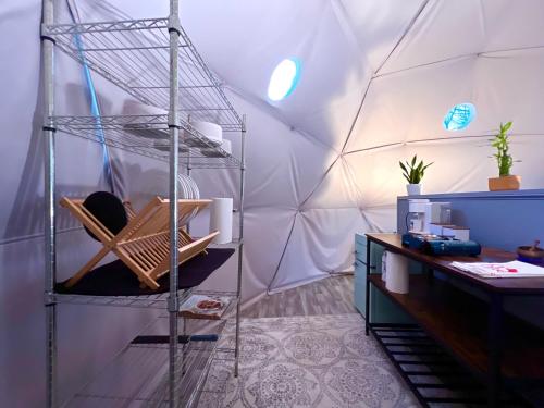 a room with a tent with a desk in it at Modern Luxury Dome near Texarkana, Texas 