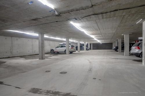 an empty parking garage with cars parked in it at Stunning Apartment in View Are Ski in - Vm8 Lift in Åre