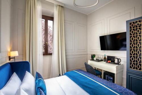 a hotel room with a bed and a tv at Navona Sky Palace in Rome