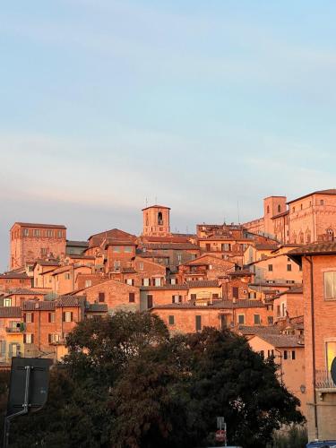 a group of brick buildings on a hill at Casa Tre Gradini in Perugia
