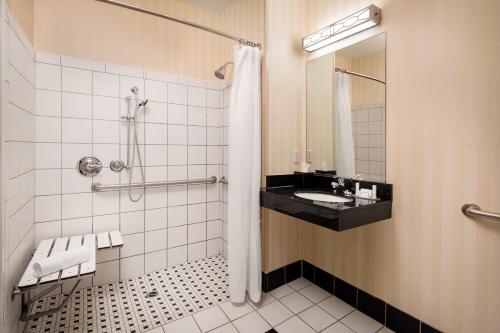 a bathroom with a sink and a shower at Fairfield Inn & Suites by Marriott Visalia Tulare in Tulare