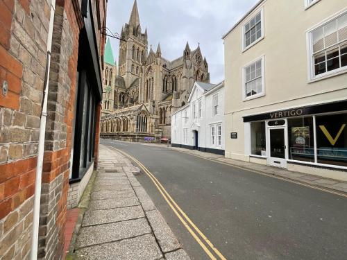 an empty street in front of a large cathedral at 8, St Marys , Private Double Ensuite Room - Room Only- Truro in Truro