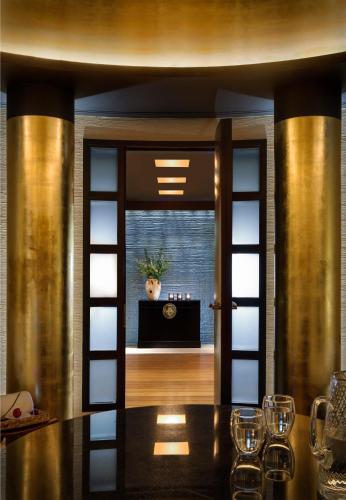 a dining room with a table with wine glasses at Rosewood London in London