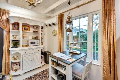 a home office with a desk and a window at New Smyrna Beach Cottage about 1 Mi to Downtown! in New Smyrna Beach