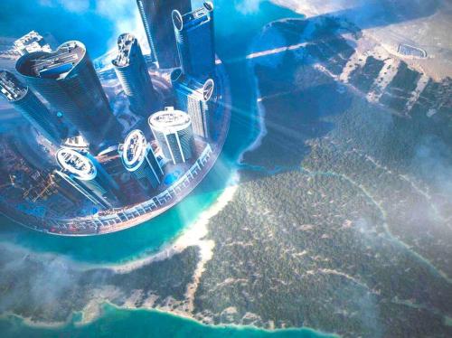 an aerial view of a city with skyscrapers at Lovely Private Contemporary Residential Apartment - 201 in Abu Dhabi