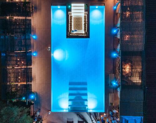 a blue building with blue lights on a city street at PARADISE RANCH in Borgo Sabotino