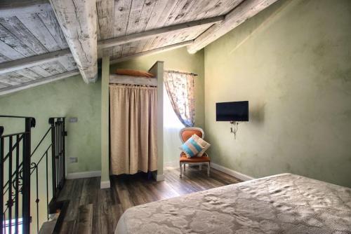 Ένα ή περισσότερα κρεβάτια σε δωμάτιο στο Casa Sale con AC e wifi in borgo ligure