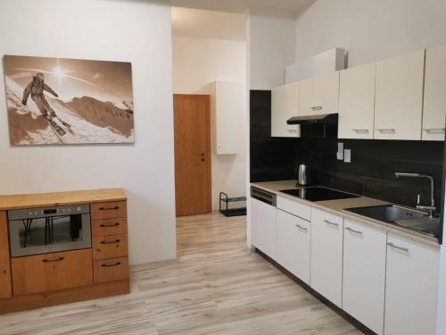A kitchen or kitchenette at Apartmán LUX
