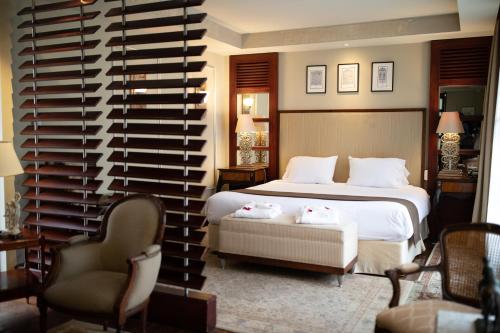a hotel room with a bed and a wine cellar at Mansion Alcazar in Cuenca