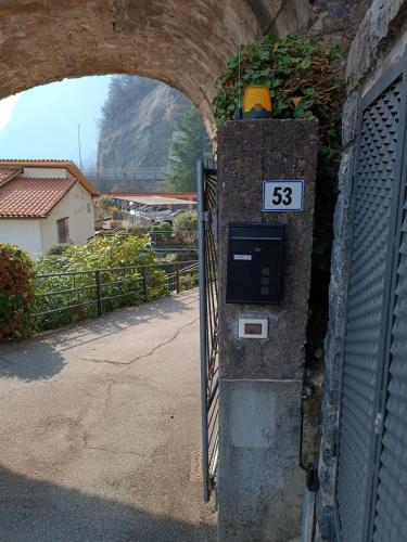 a meter on the side of a building with a clock at Studio Zu - Lakeside Apartment in Riva di Solto