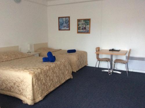 Ένα ή περισσότερα κρεβάτια σε δωμάτιο στο Heyfield Motel and Apartments