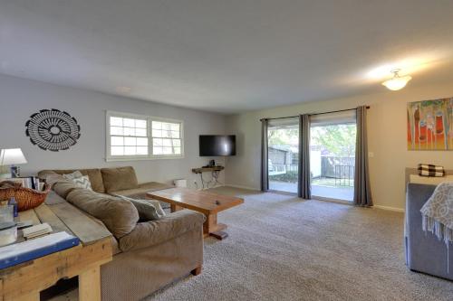 a living room with a couch and a table at The Ranger House Columbus Home Fenced Backyard in Columbus