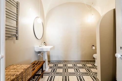 a bathroom with a sink and a mirror at Casa Garcia in Amareleja