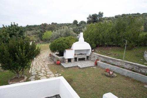 a backyard with a large white object in a yard at Sea Breeze Paradise in Paliouri