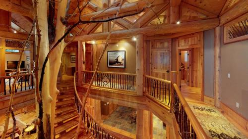 an overhead view of a staircase in a log home at Seneca Lodge in Cooperstown